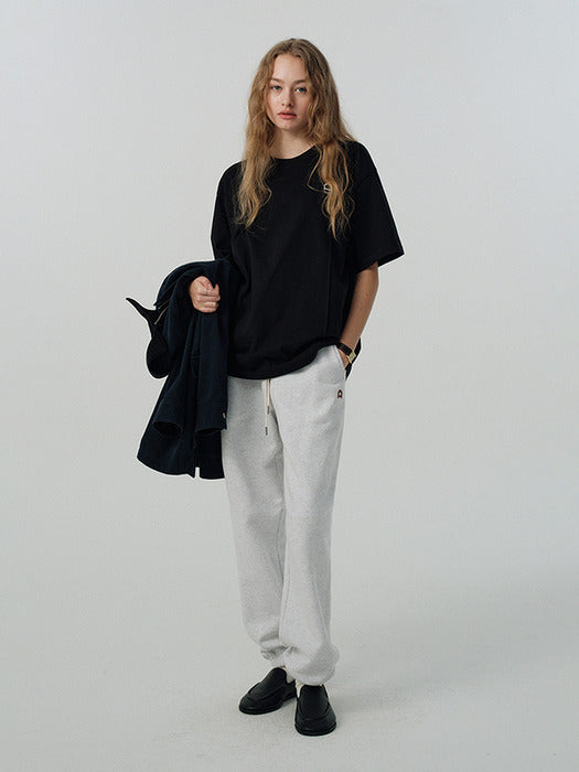 UNISEX LEATHER LOGO SWEAT PANTS LIGHT MELANGE GREY_UDPA5A101G1