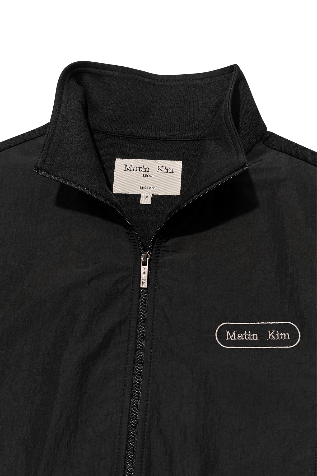 [matinkim] HIGH NECK WINDBREAKER ZIP UP FOR WOMEN IN BLACK