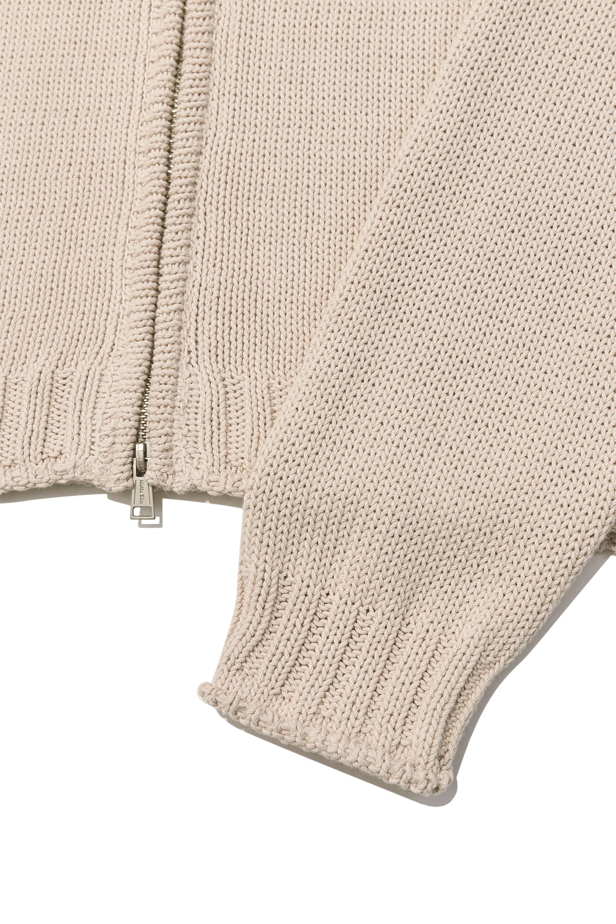 [matinkim] APPLIQUE LOGO PATCH KNIT ZIP UP FOR MEN IN LIGHT BEIGE