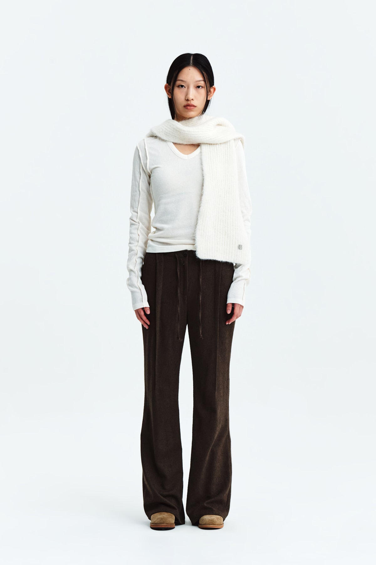 [matinkim] WAIST BUTTON POINT STRING SLIM PANTS IN BROWN
