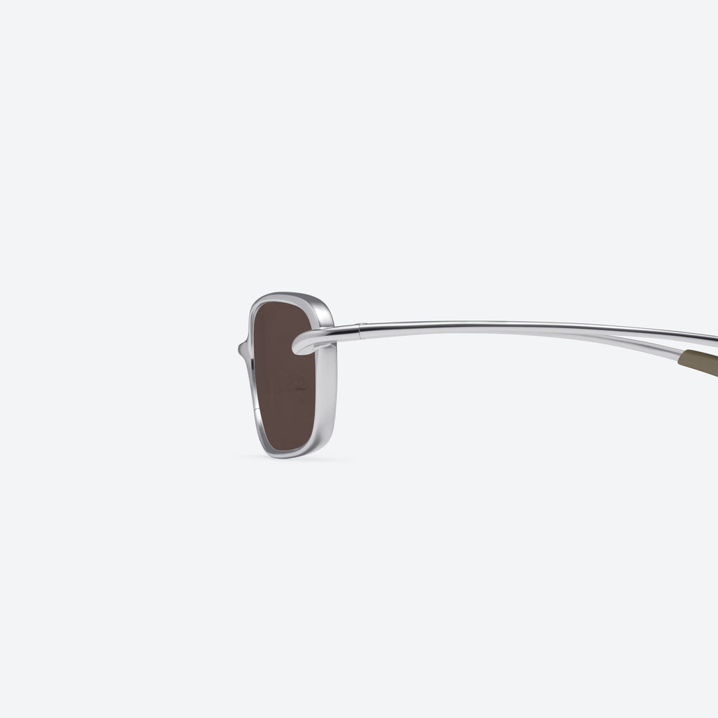 Gentle Monster Rollie 02(BR) Sunglasses in silver, showcasing authentic Korean designer fashion.