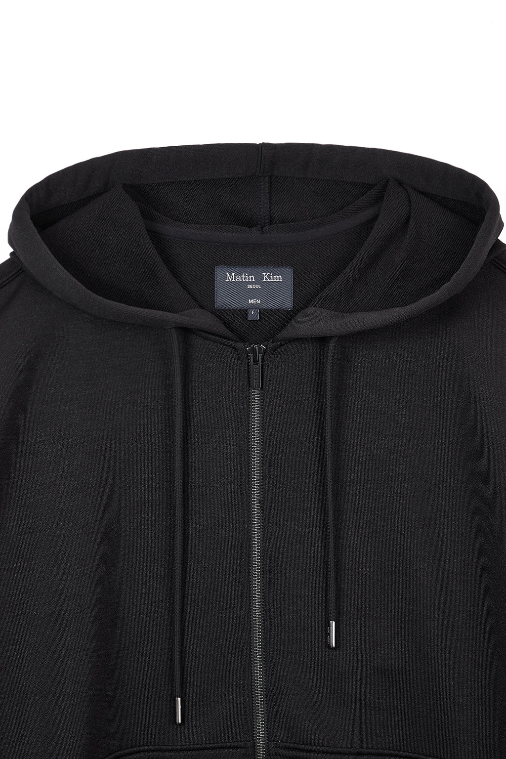 [matinkim] BACK LOGO GLITTER HOODY ZIP UP FOR MEN IN BLACK