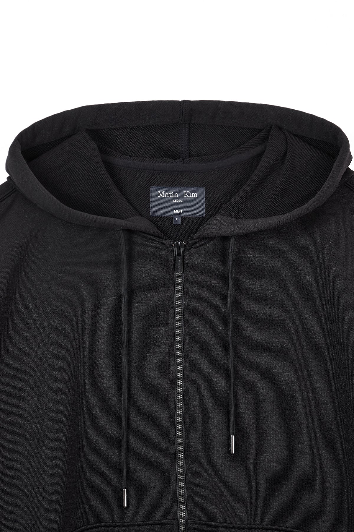 [matinkim] BACK LOGO GLITTER HOODY ZIP UP FOR MEN IN BLACK