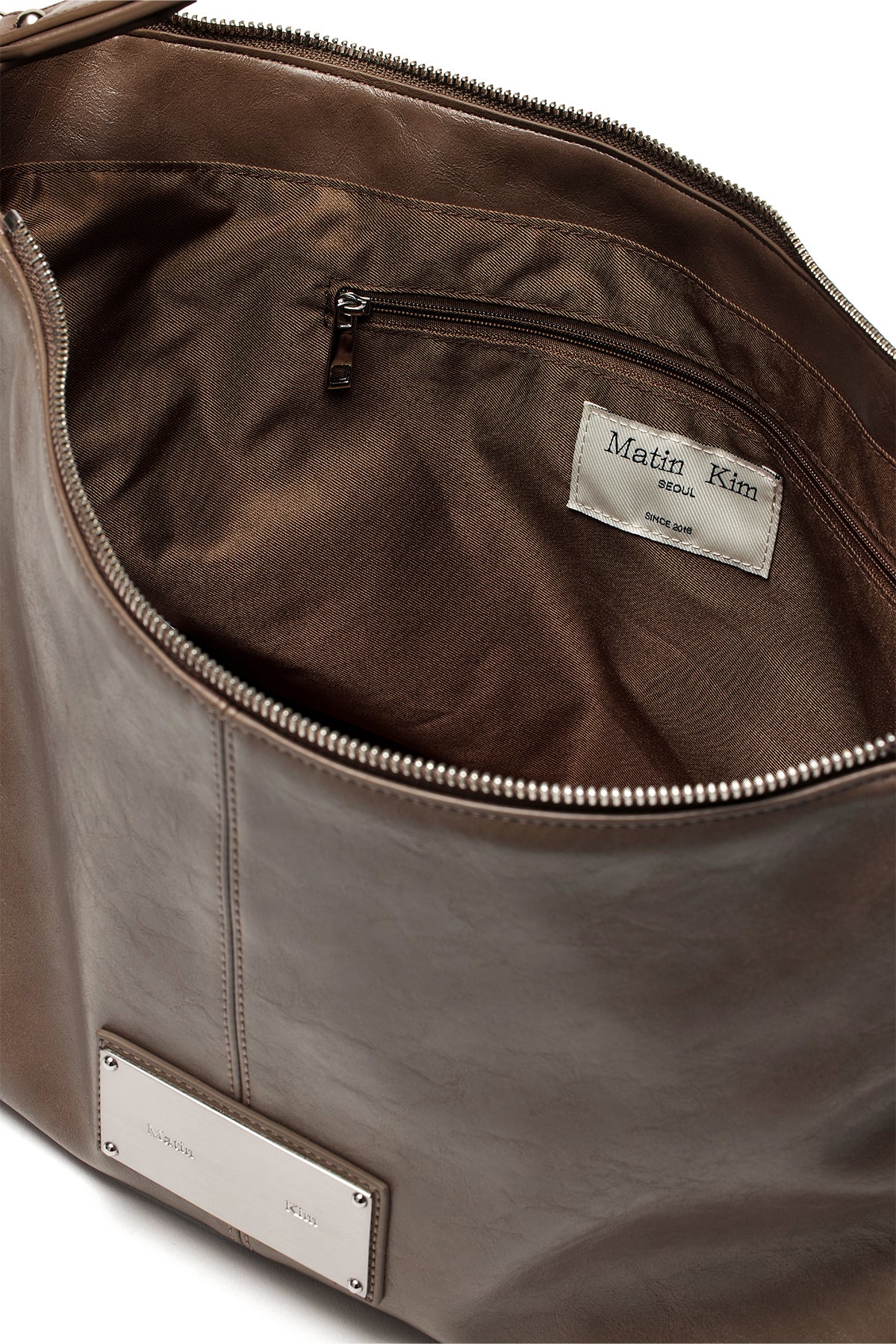 [matinkim] SIDE ZIPPER SHOULDER BAG IN DARK BROWN