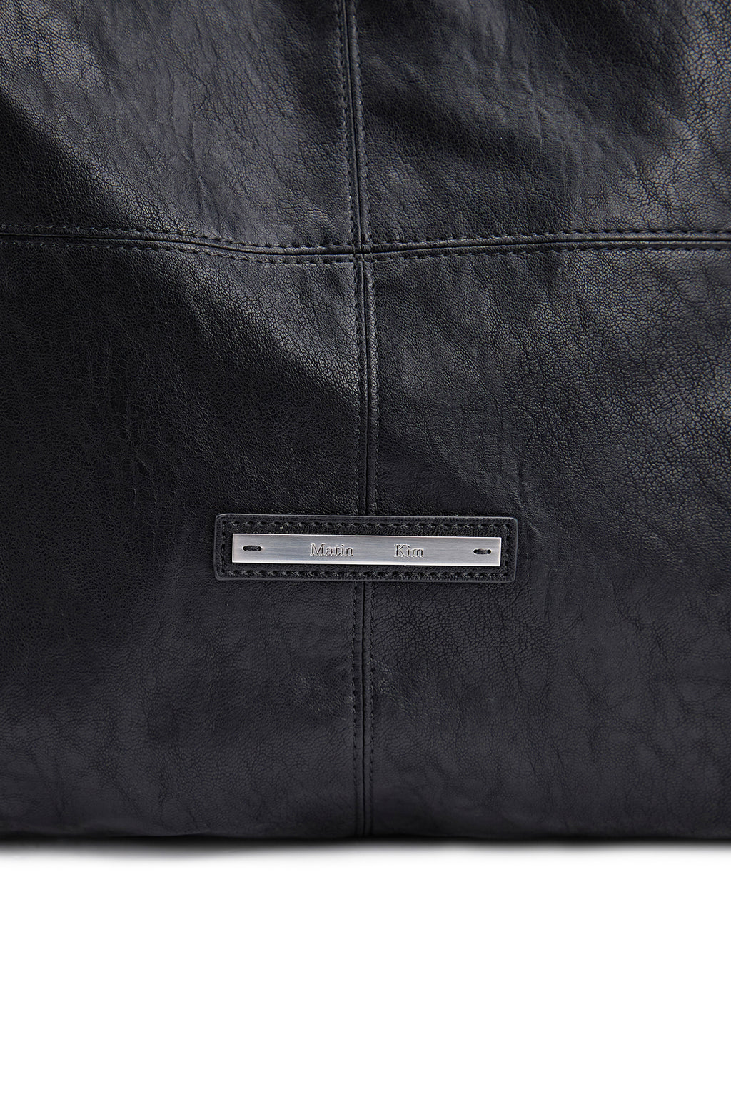 [matinkim] SIDE STRING LEATHER BIG SHOULDER BAG IN BLACK
