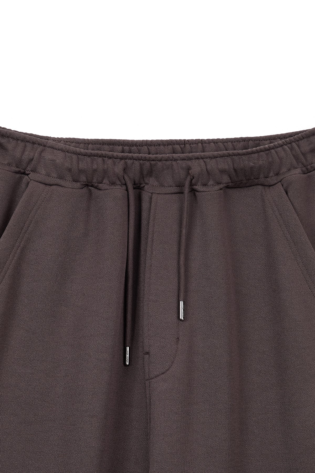 [matinkim] BACK POCKET GLITTER SWEATPANTS FOR MEN IN BROWN