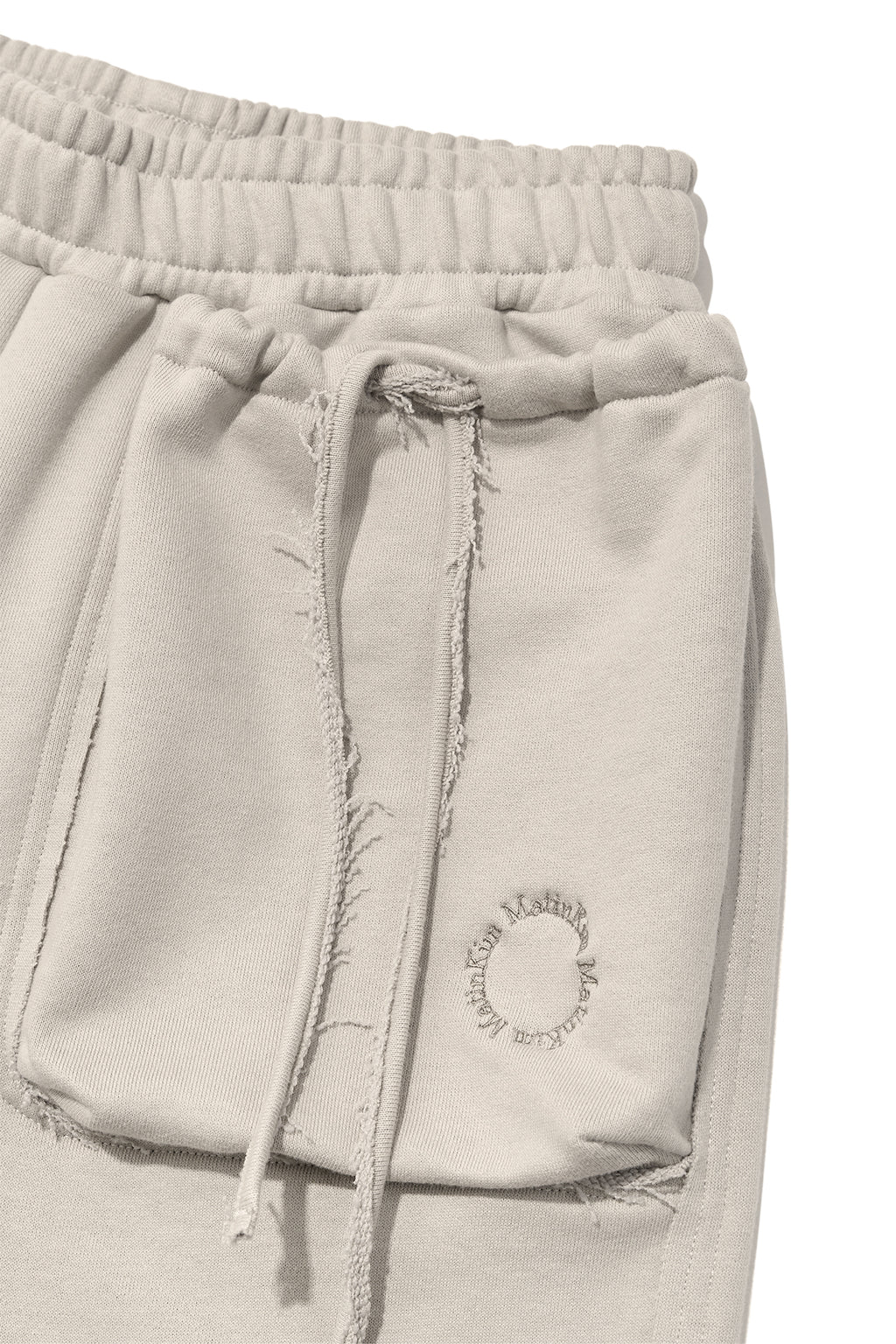 [matinkim] VOLUME POCKET SWEATPANTS IN PALE BEIGE