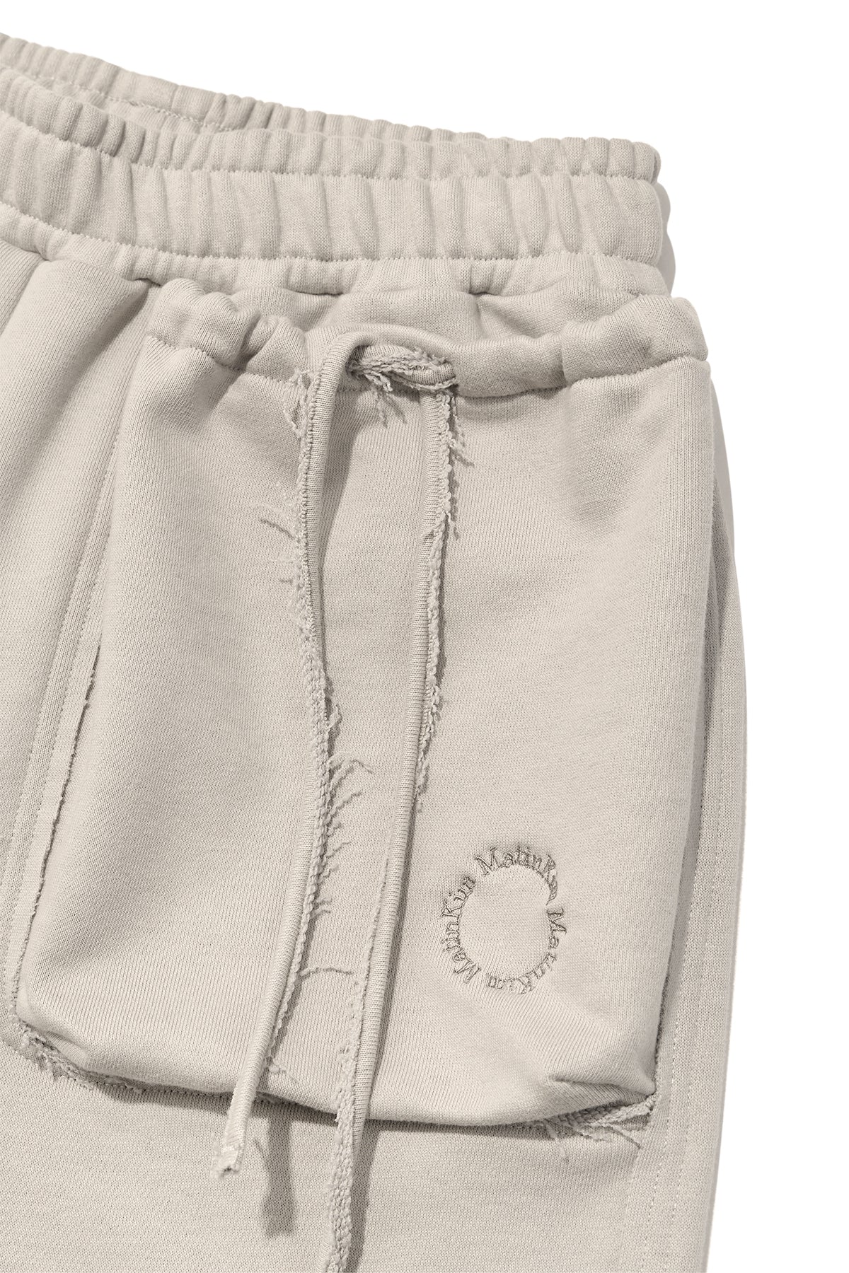 [matinkim] VOLUME POCKET SWEATPANTS IN PALE BEIGE