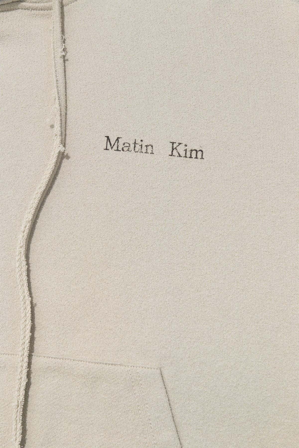 [matinkim] RIB CUT DETAIL LOGO HOODY IN BEIGE