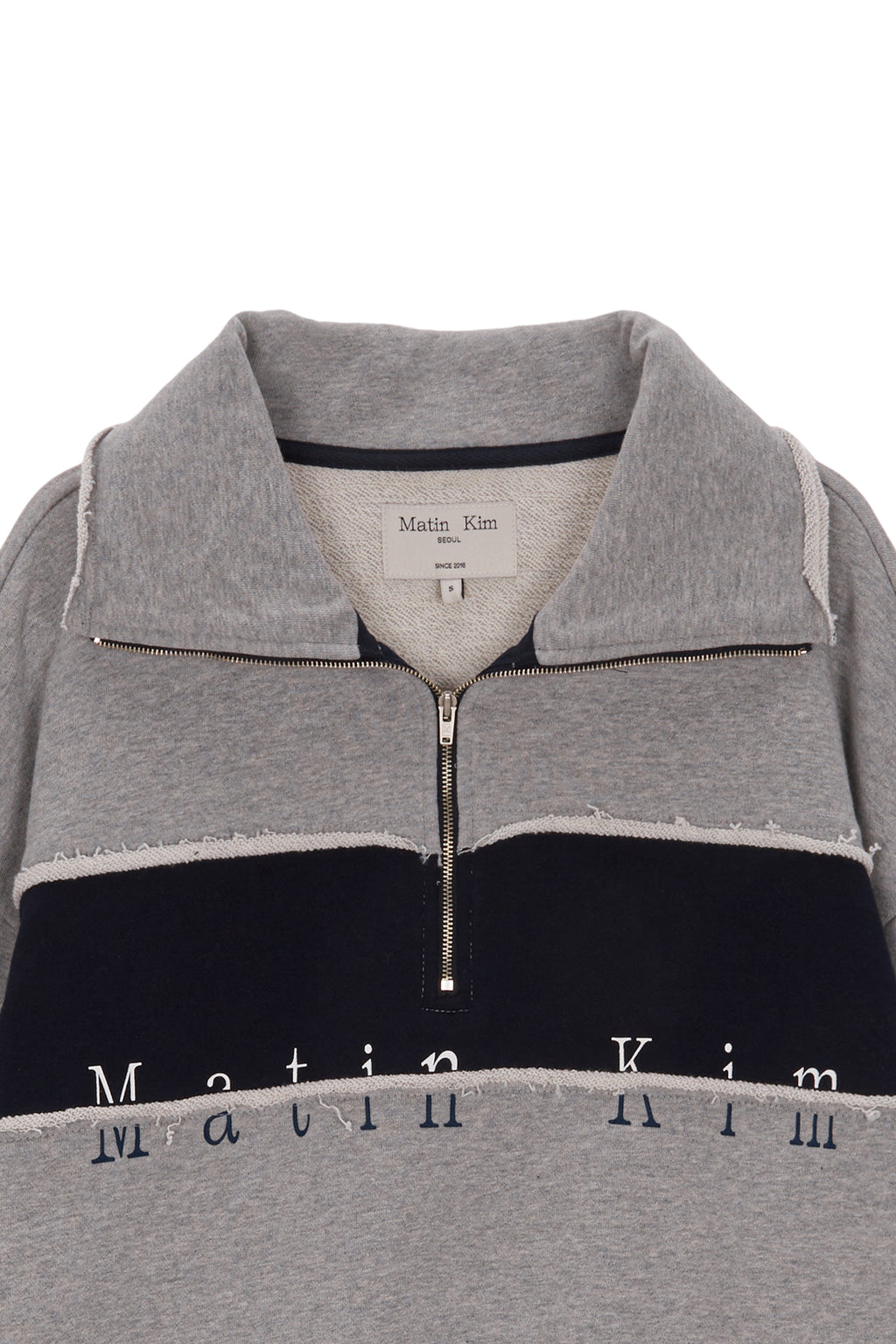 [matinkim] CUTTED LOGO HALF ZIP SWEATSHIRT IN GREY