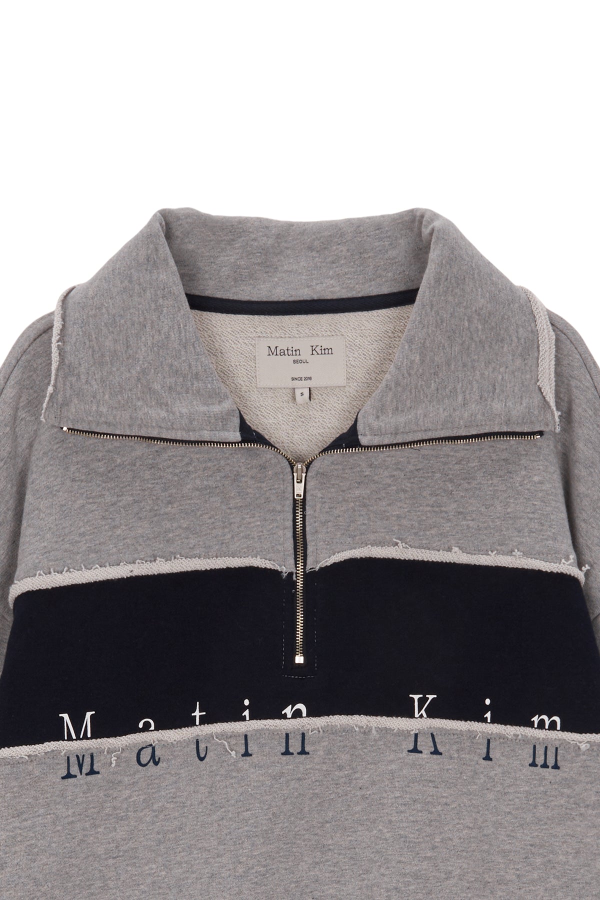 [matinkim] CUTTED LOGO HALF ZIP SWEATSHIRT IN GREY