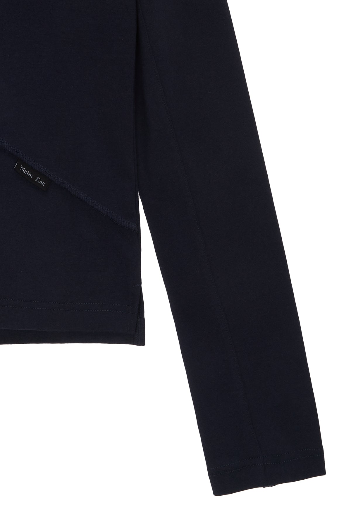 [matinkim] DIAGONAL SLIMFIT LONG SLEEVE TOP IN NAVY