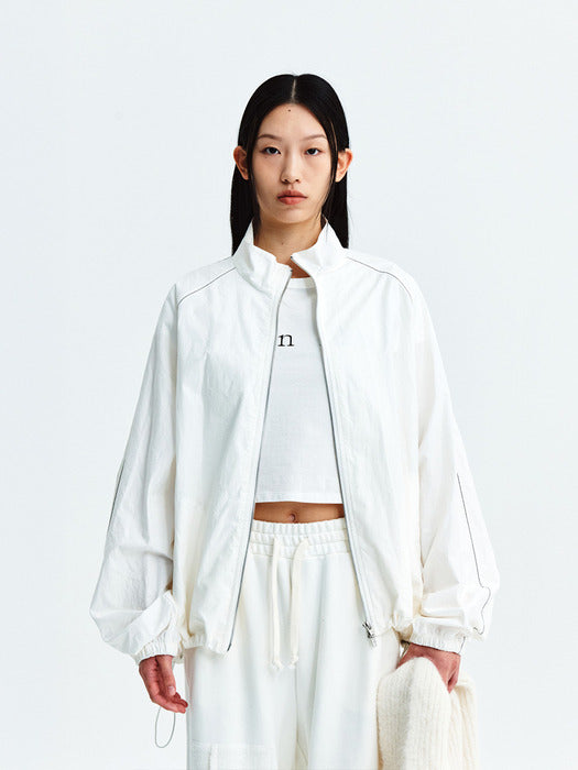 MATIN KIM LOGO COATING JUMPER IN IVORY
