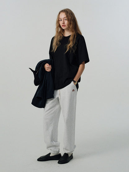 UNISEX LEATHER LOGO SWEAT PANTS LIGHT MELANGE GREY_UDPA5A101G1