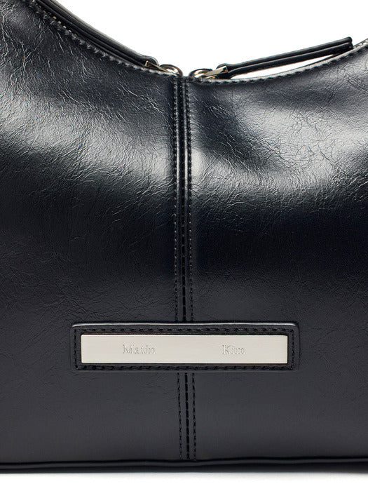 ASYMMETRICAL ZIPPER BAG IN BLACK