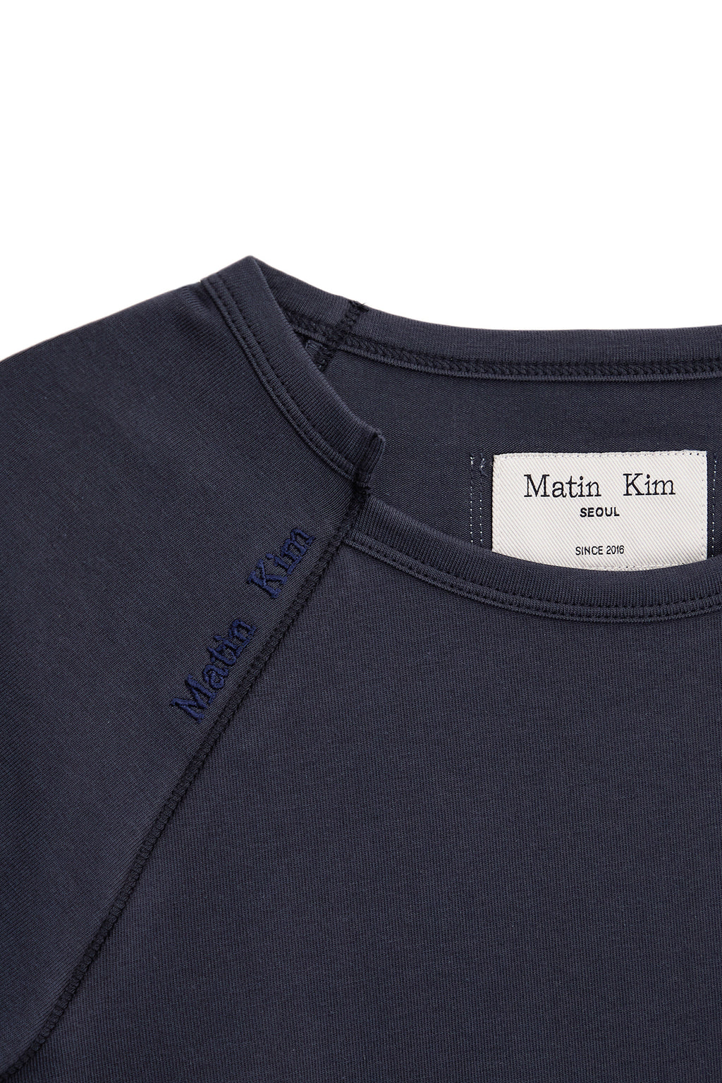 [matinkim] TWIST POINT SLIM TOP IN DARK NAVY