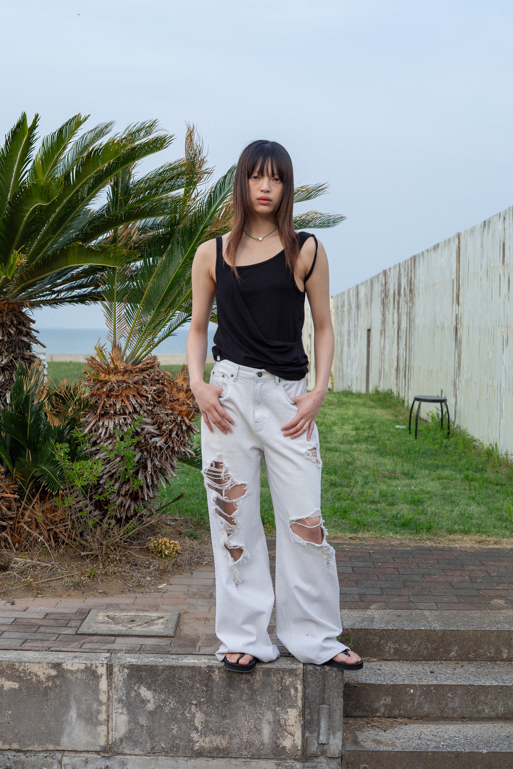 Matinkim Unbalance Tuck Sleeveless Top IN Black