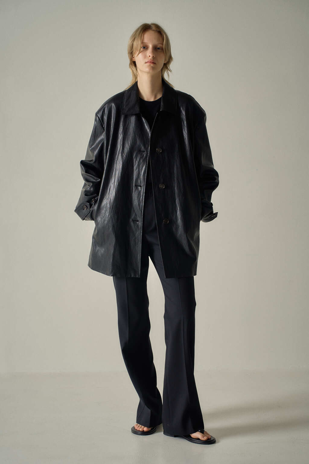 Facade Pattern Leather Half Coat black