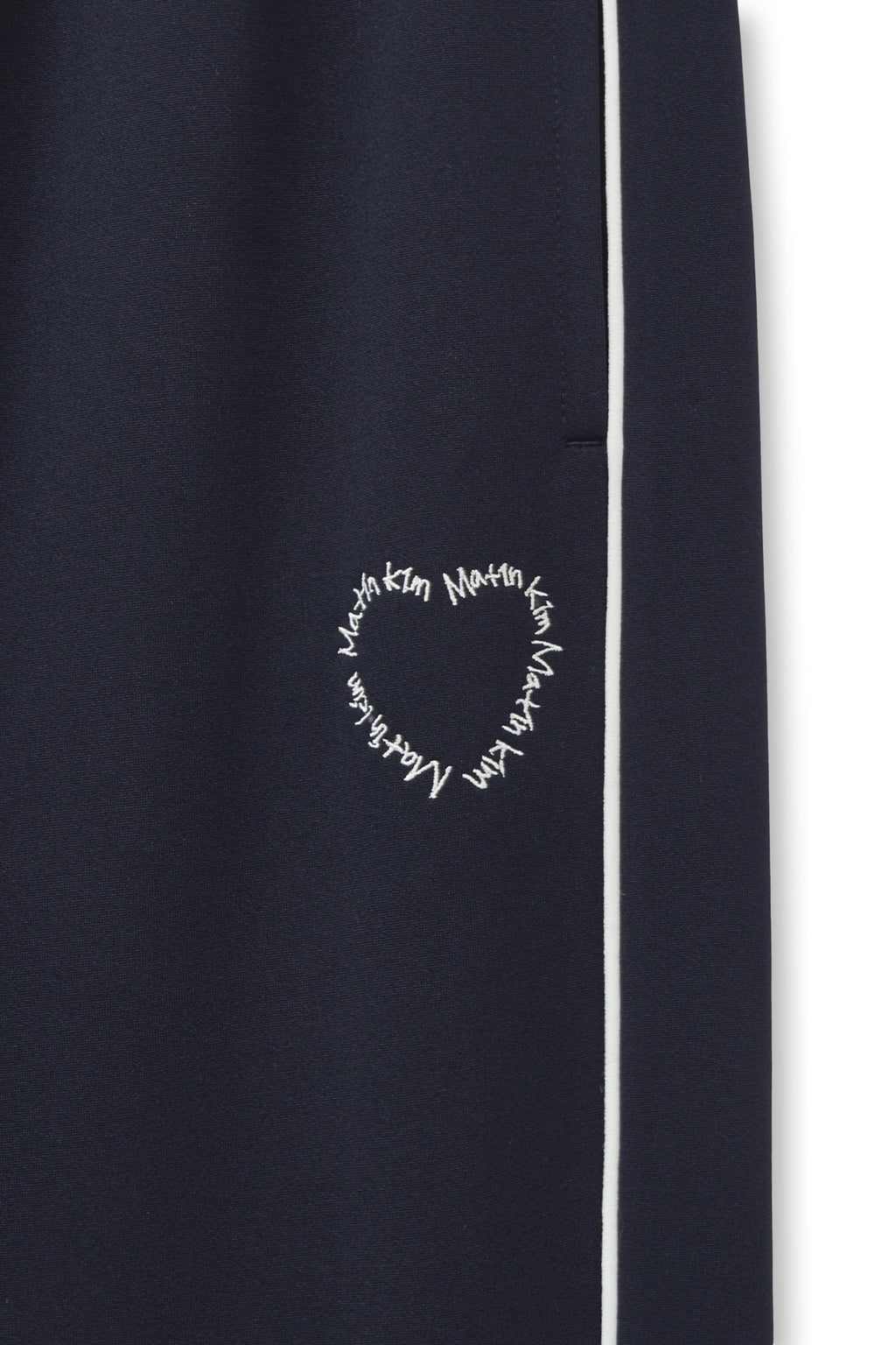 [matinkim] HEART LOGO TRACK PANTS IN NAVY