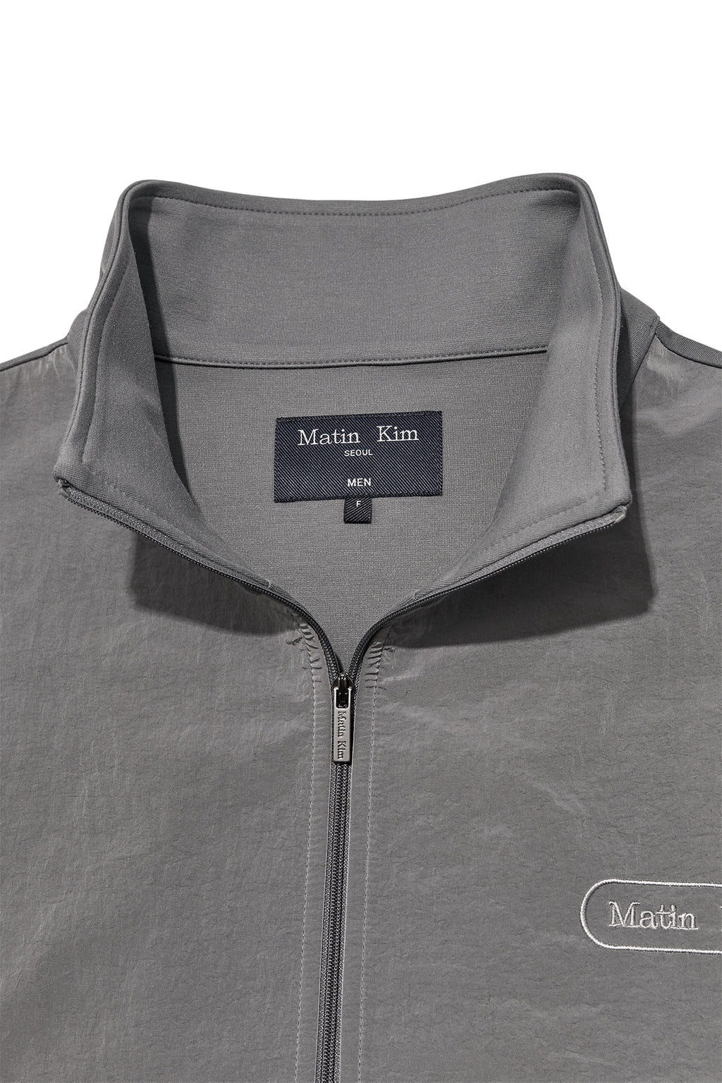 [matinkim] HIGH NECK WINDBREAKER ZIP UP FOR MEN IN GREY