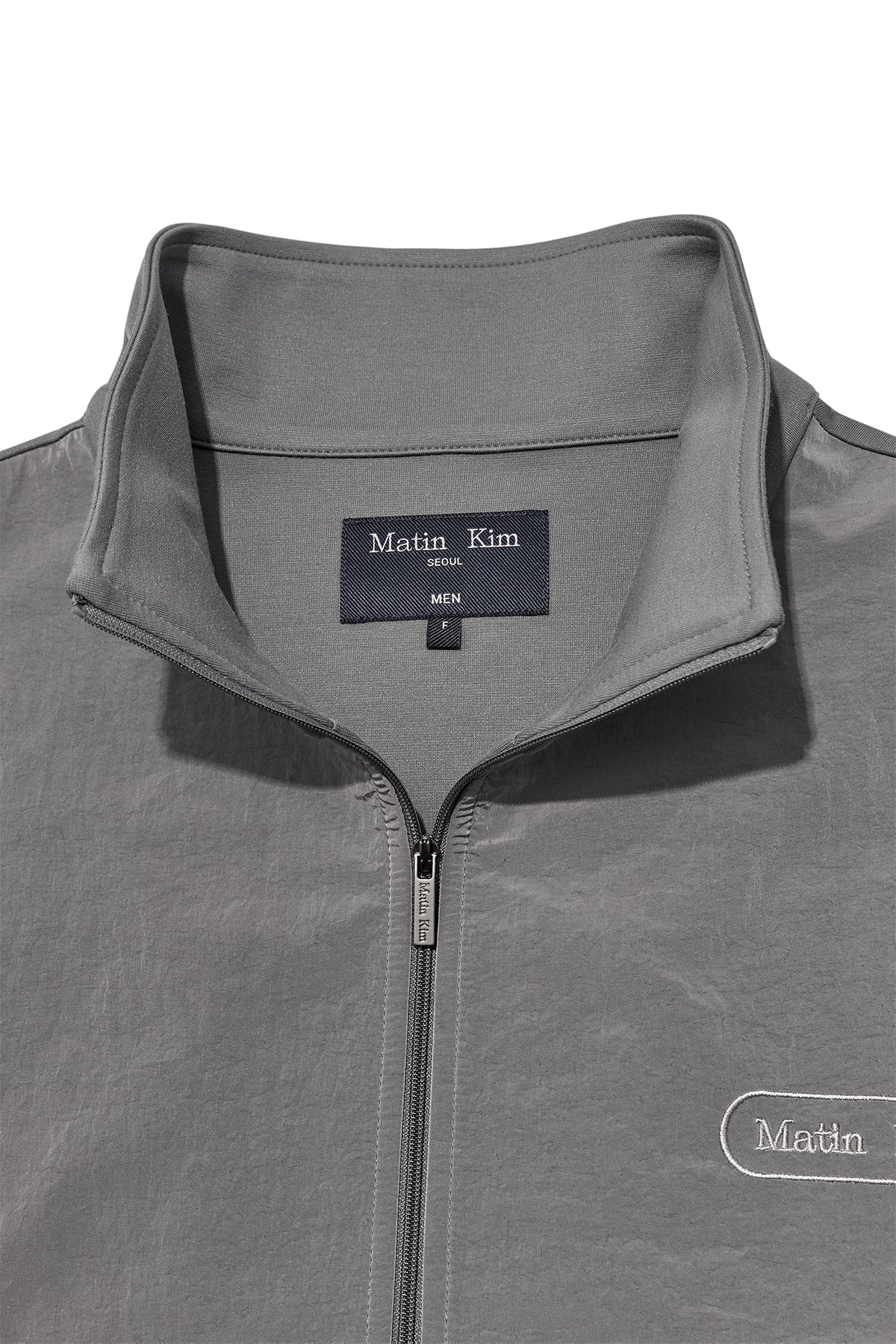 [matinkim] HIGH NECK WINDBREAKER ZIP UP FOR MEN IN GREY