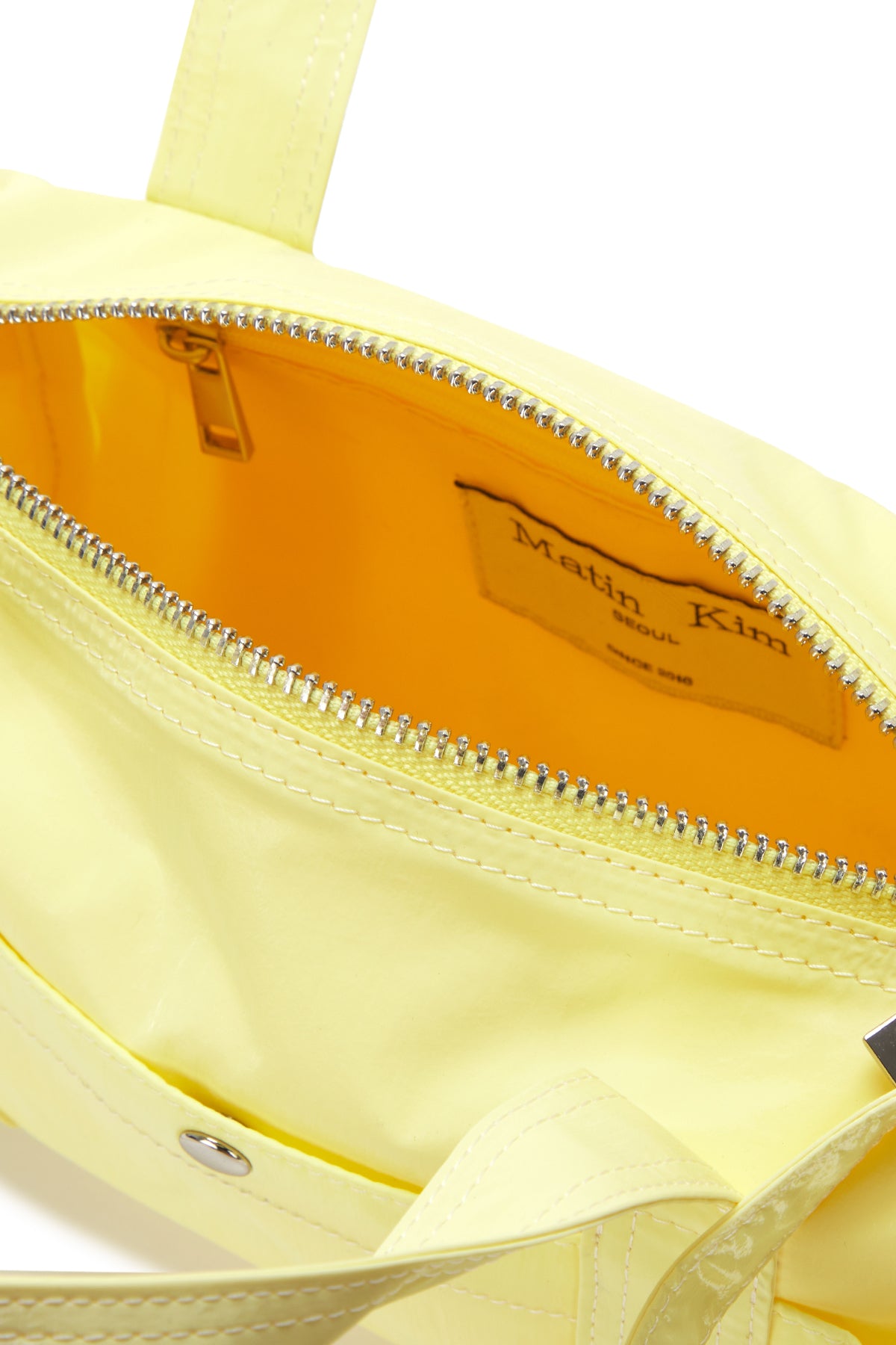 [matinkim] GLOSSY LOGO SPORTY MINI DUFFEL BAG IN LIGHT YELLOW
