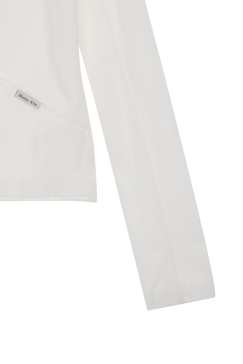 [matinkim] DIAGONAL SLIMFIT LONG SLEEVE TOP IN WHITE