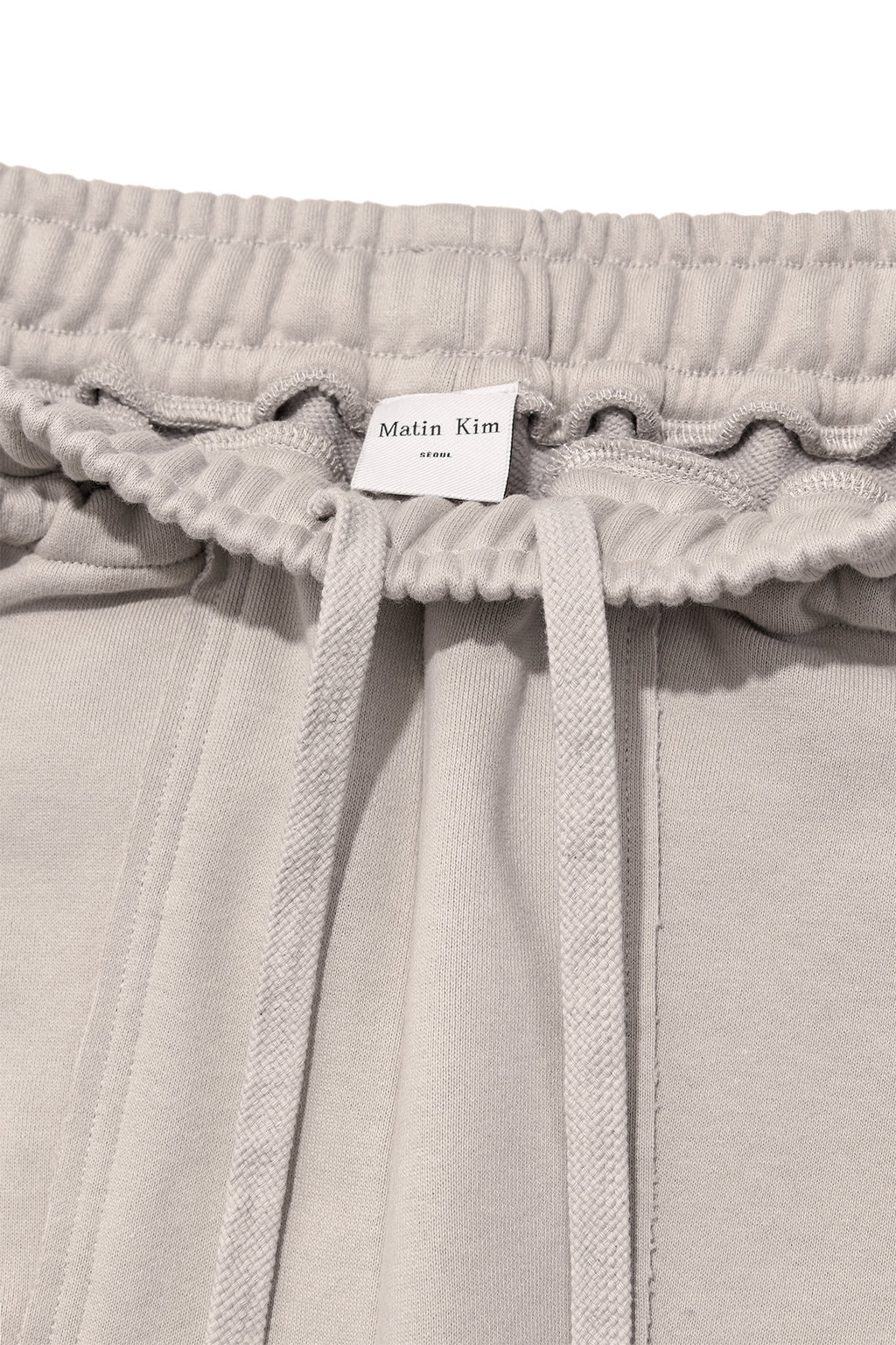 [matinkim] VOLUME POCKET SWEATPANTS IN BEIGE