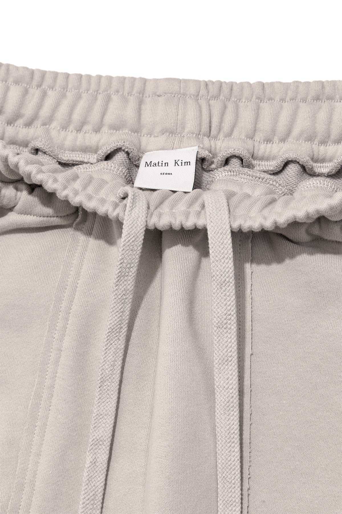 [matinkim] VOLUME POCKET SWEATPANTS IN BEIGE
