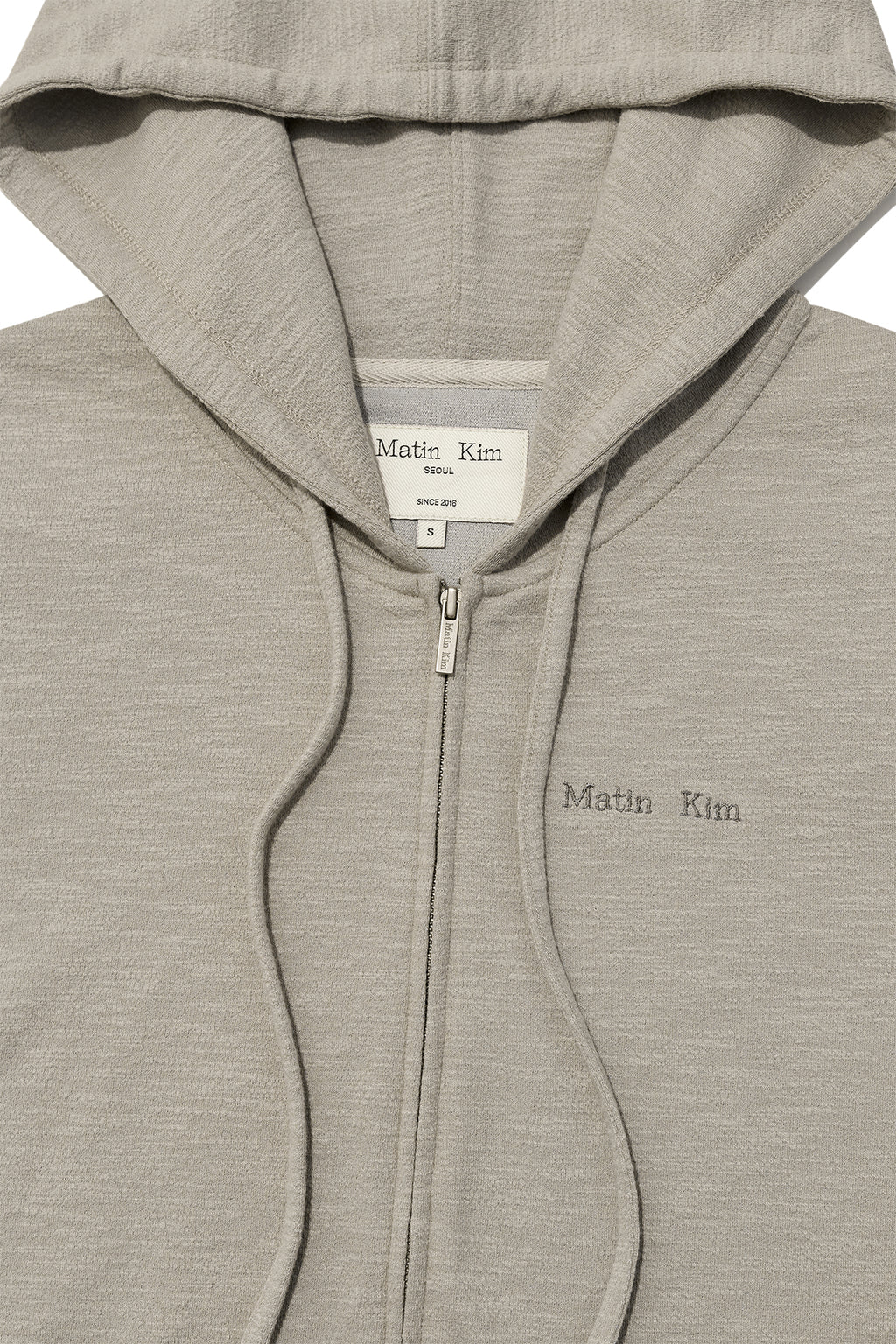 [matinkim] SLEEVE SLIT POINT HOODY ZIP UP IN BEIGE