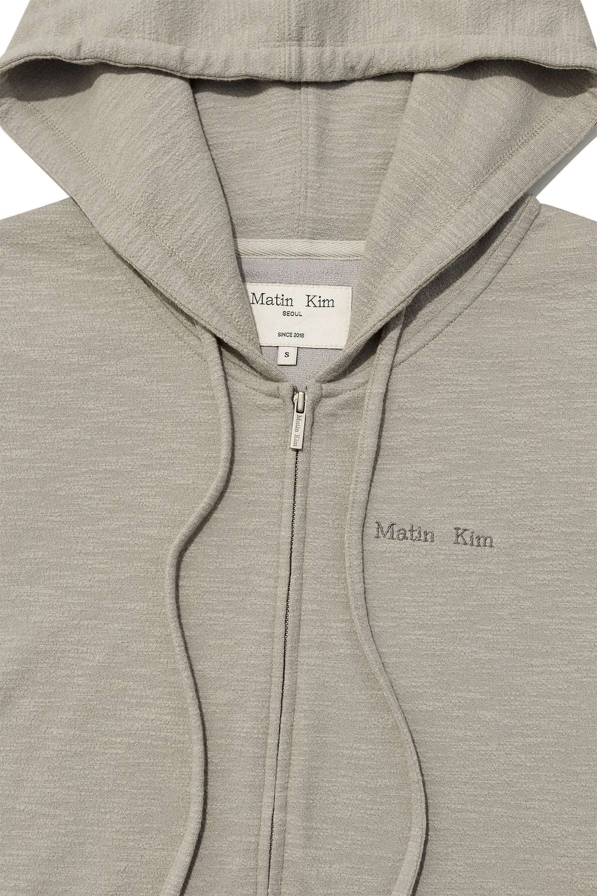 [matinkim] SLEEVE SLIT POINT HOODY ZIP UP IN BEIGE