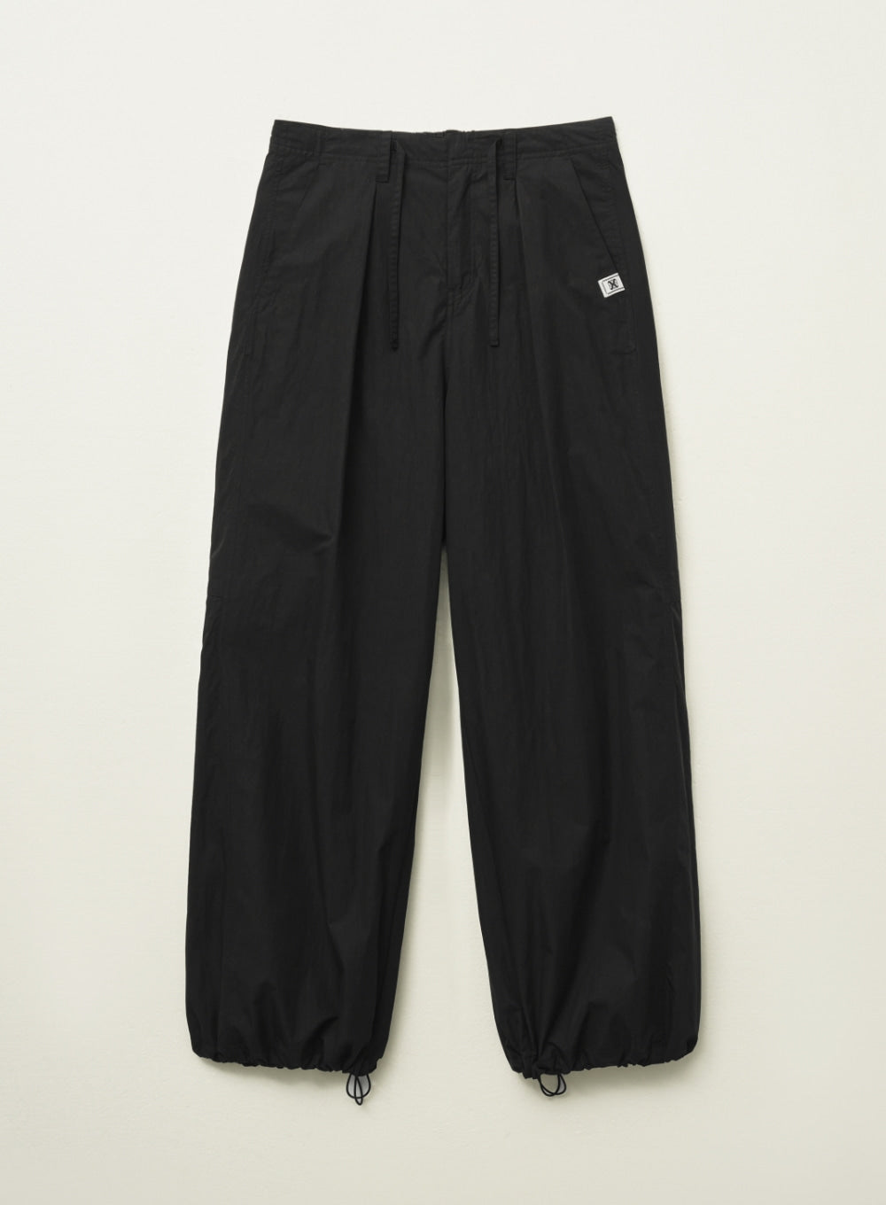 [satur] Curved Parachute Pants - Black