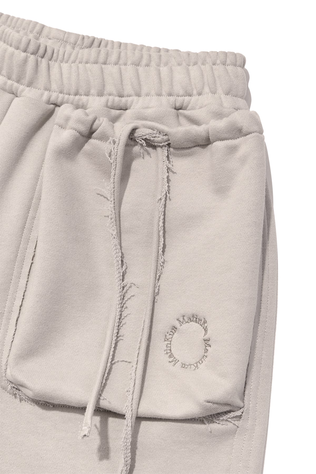 [matinkim] VOLUME POCKET SWEATPANTS IN BEIGE