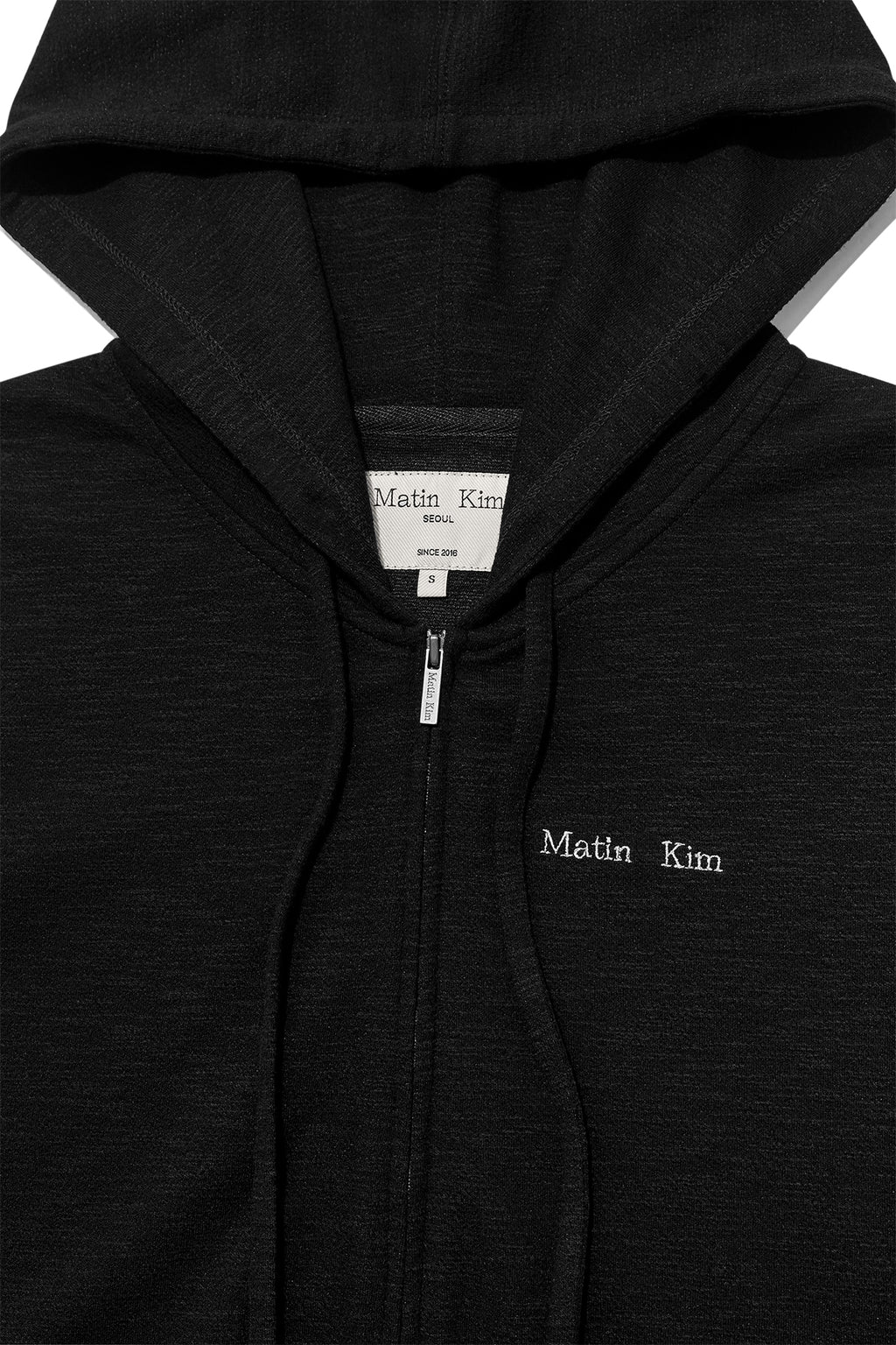 [matinkim] SLEEVE SLIT POINT HOODY ZIP UP IN BLACK