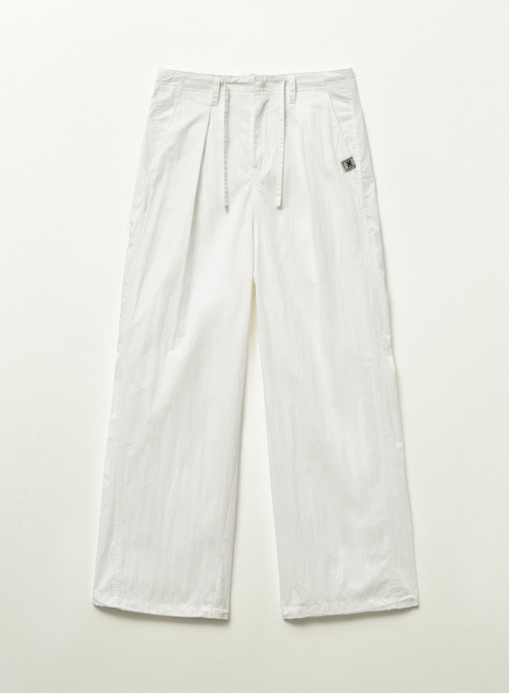 [satur] Curved Parachute Pants - White