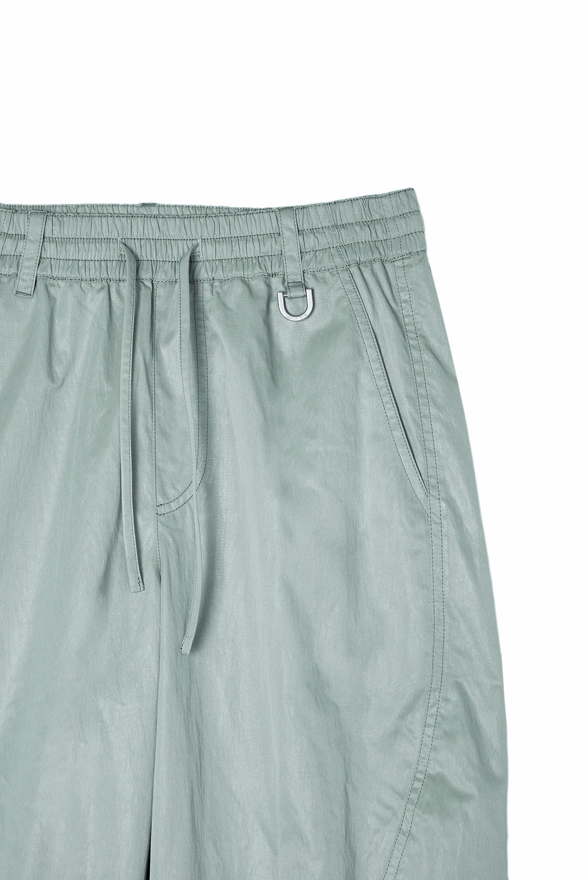 [matinkim] GLOSSY BANDING TRACK PANTS IN MINT