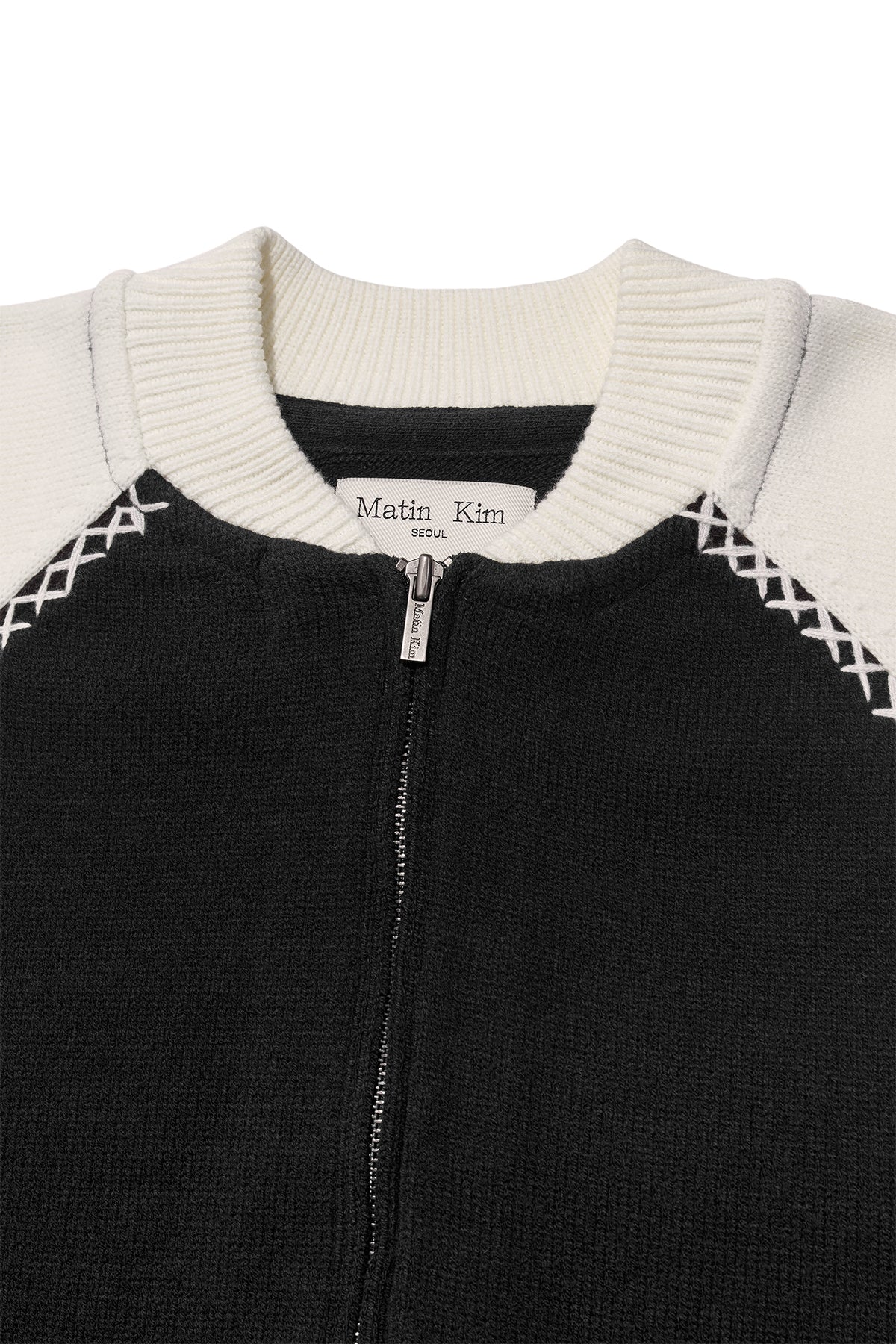 [matinkim] BACK LOGO RAGLAN KNIT ZIP UP IN BLACK