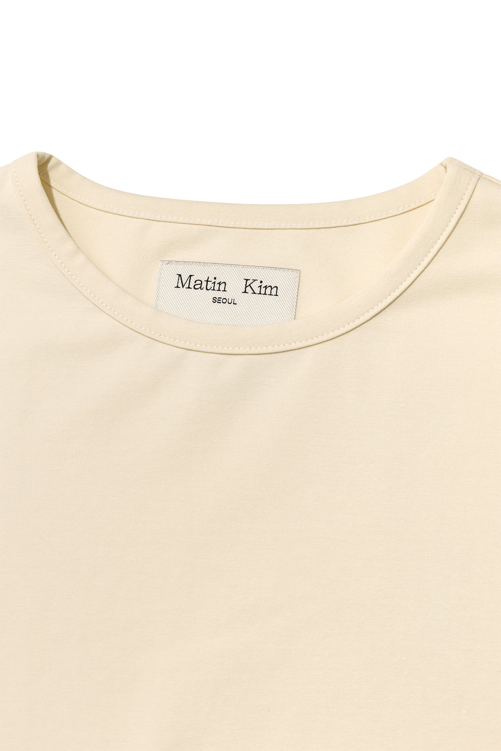 [matinkim] SLIT BUTTON POINT CROP TOP IN IVORY