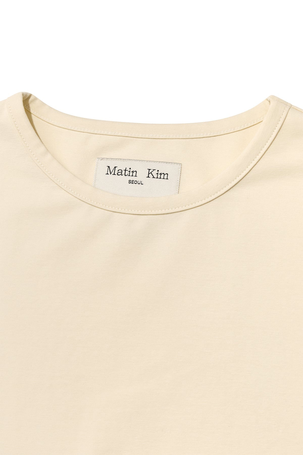 [matinkim] SLIT BUTTON POINT CROP TOP IN IVORY