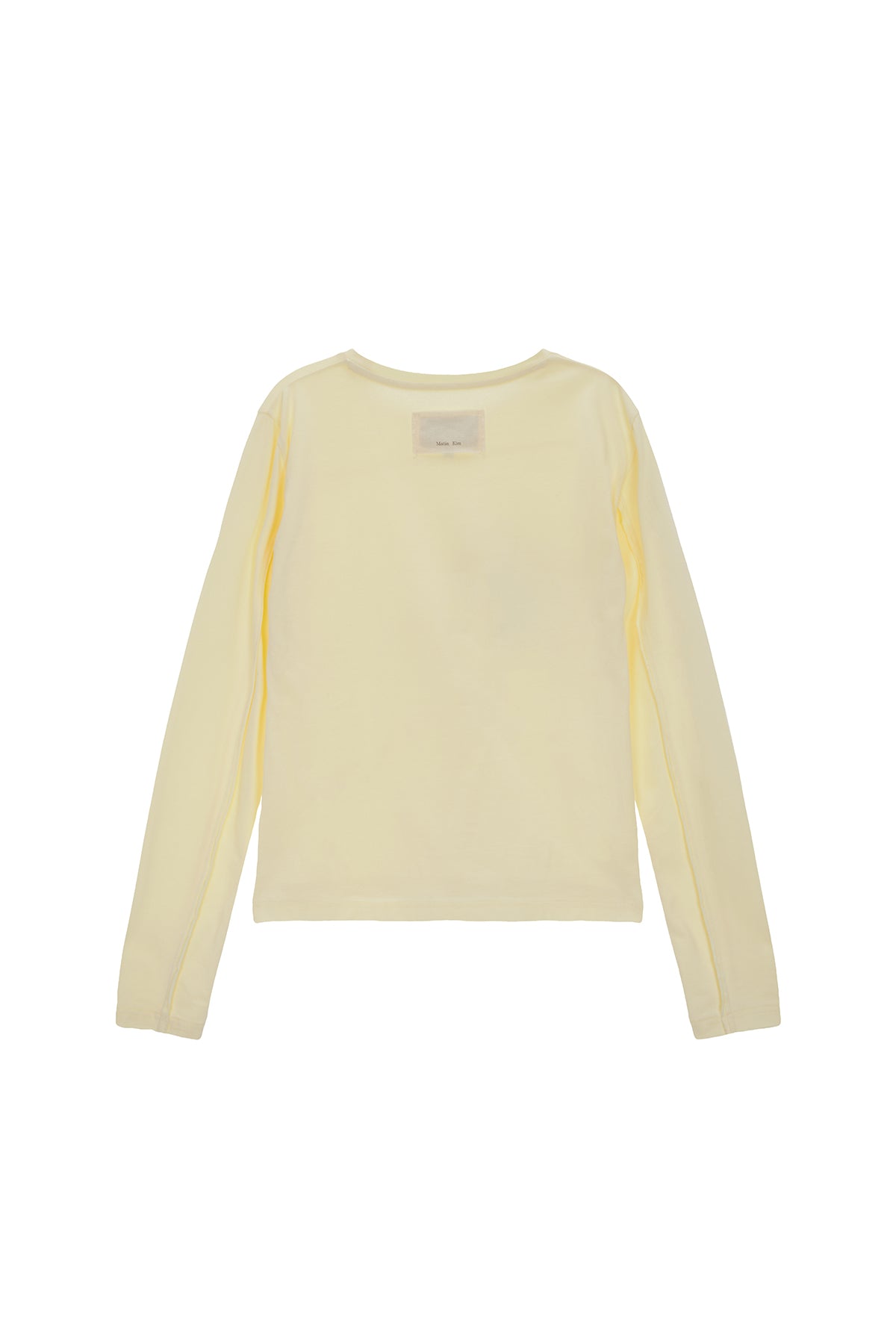 [matinkim] DIAGONAL SLIMFIT LONG SLEEVE TOP IN LIGHT YELLOW