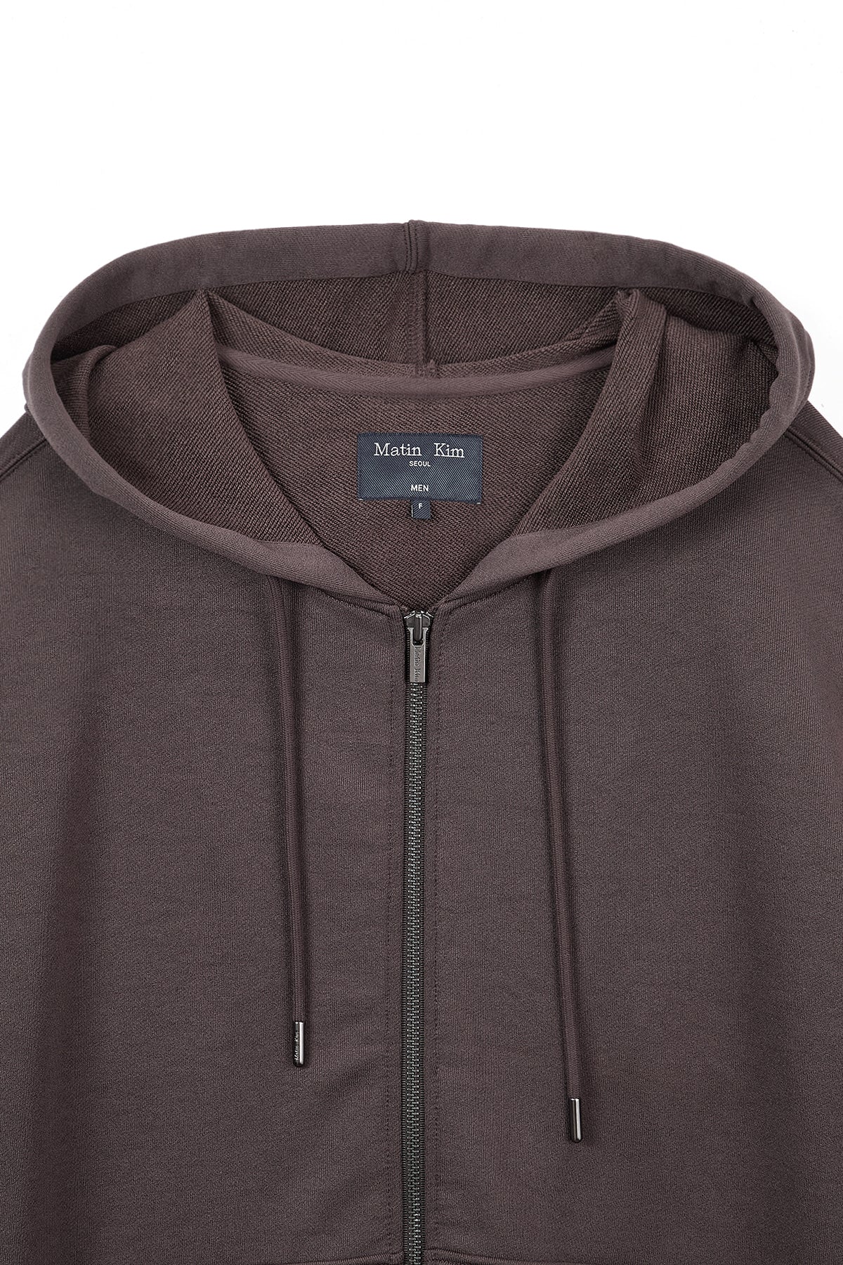 [matinkim] BACK LOGO GLITTER HOODY ZIP UP FOR MEN IN BROWN