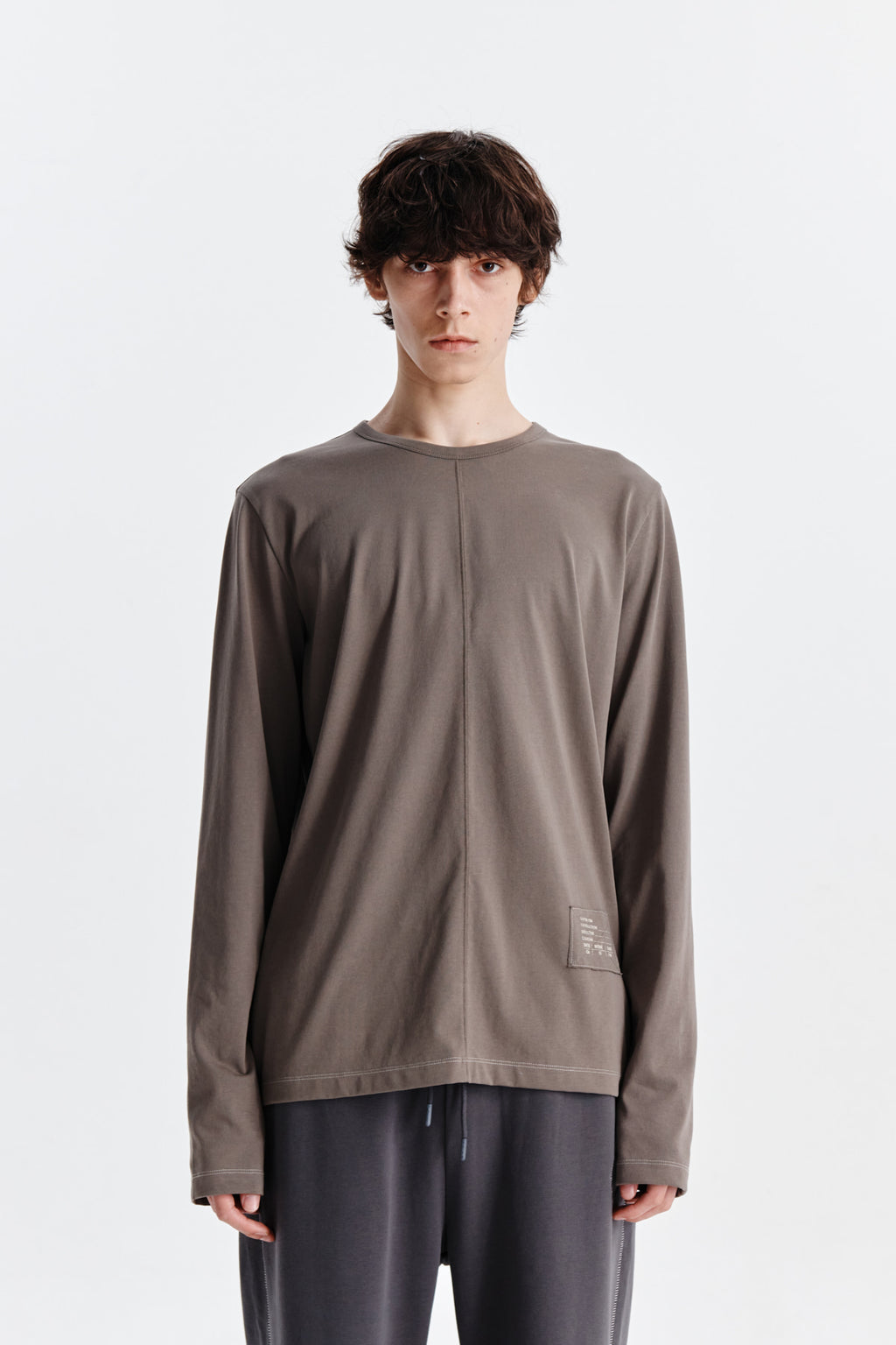 [matinkim] PATCH GRAPHIC POINT LONG SLEEVE TOP FOR MEN IN KHAKI