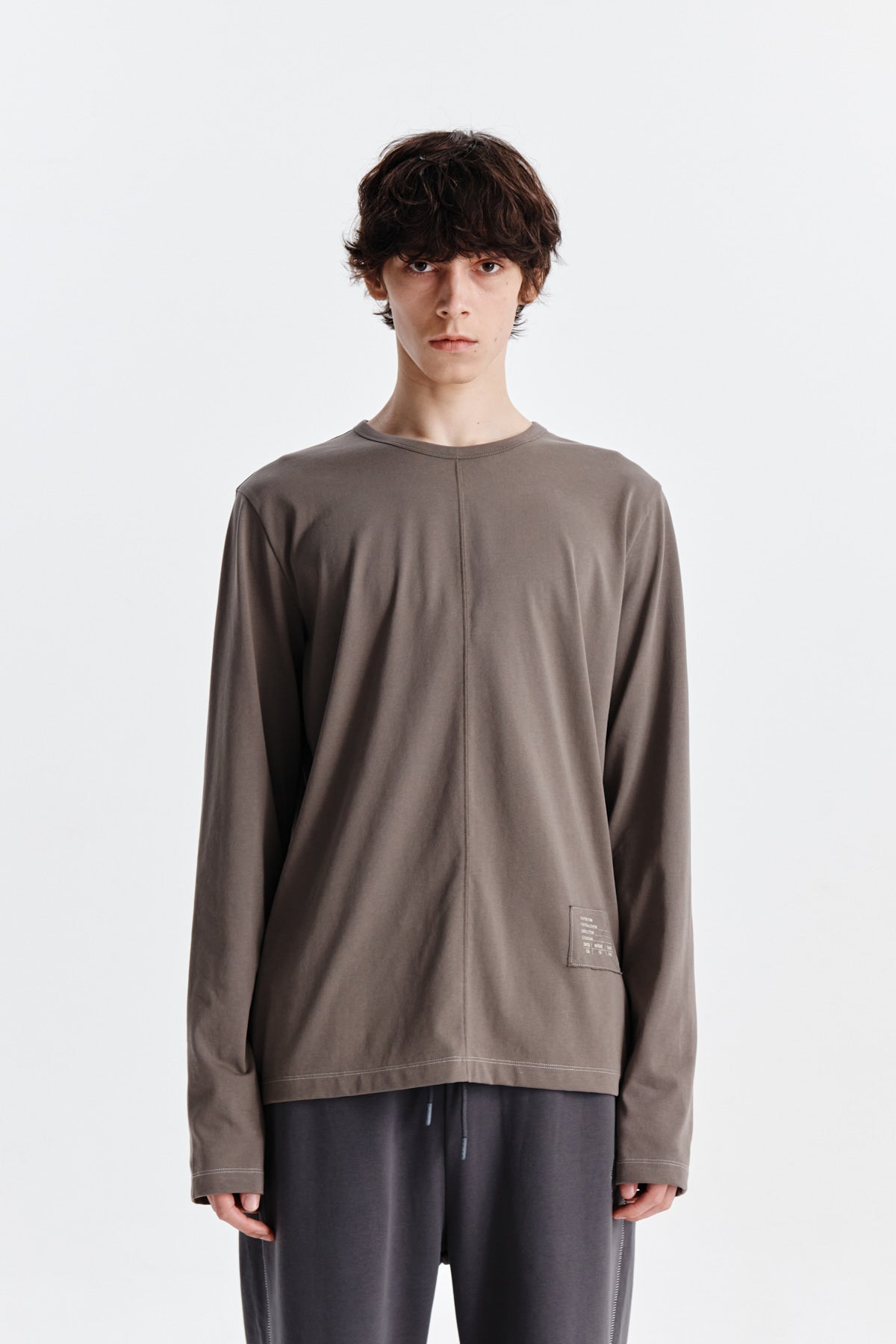 [matinkim] PATCH GRAPHIC POINT LONG SLEEVE TOP FOR MEN IN KHAKI