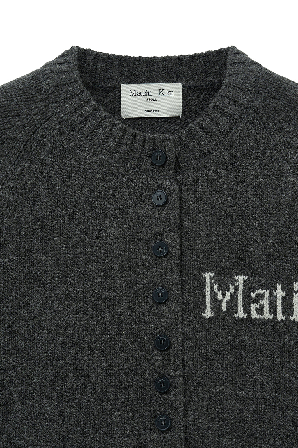 [matinkim] BUTTON POINT HENLY NECK LOGO KNIT TOP IN CHARCOAL
