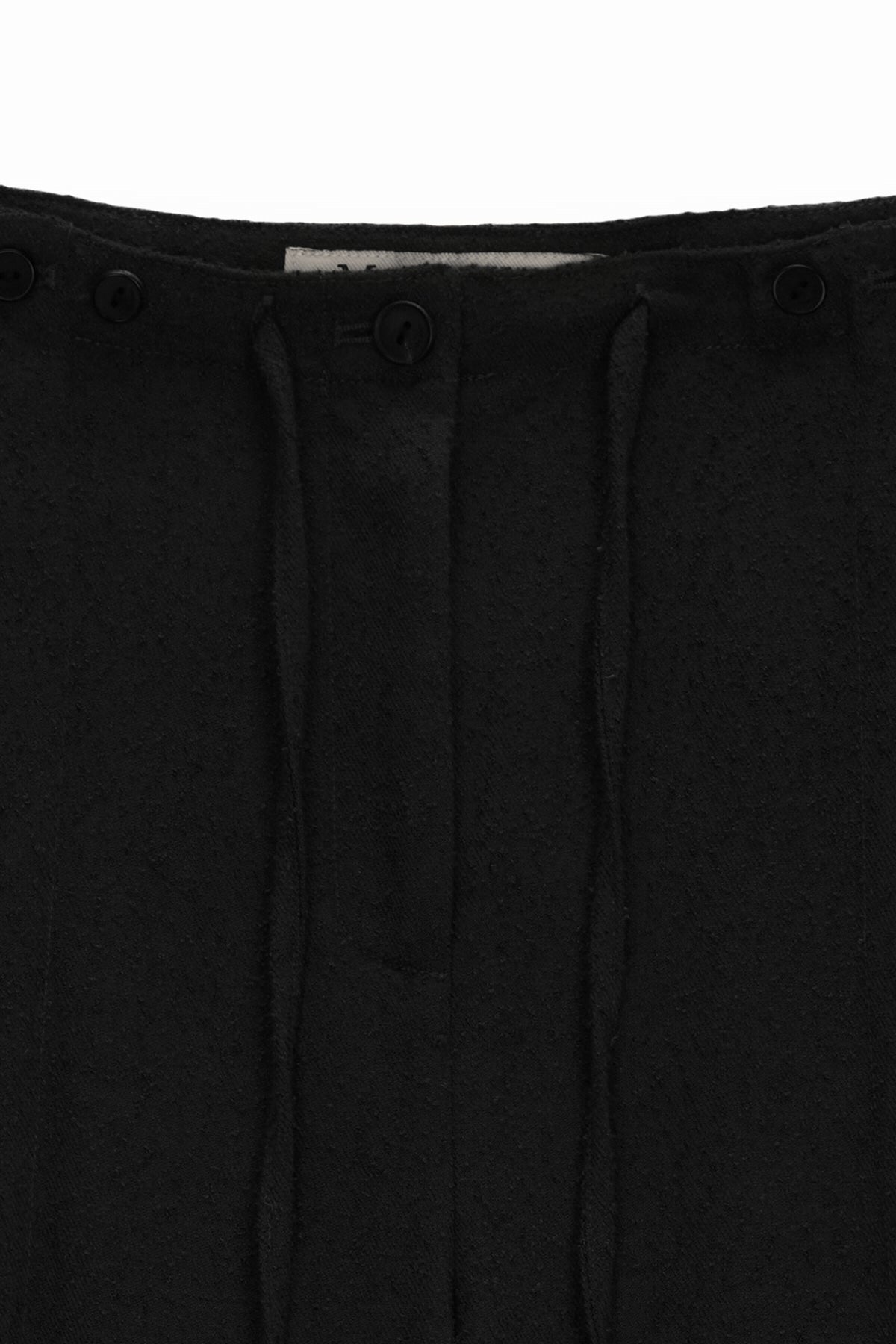 [matinkim] WAIST BUTTON POINT STRING SLIM PANTS IN BLACK