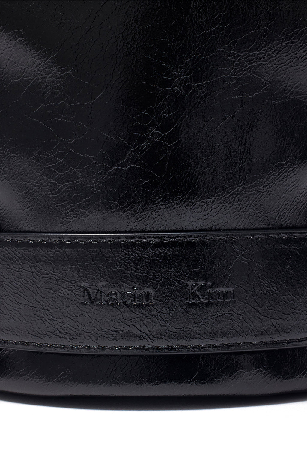[matinkim] BELTED MINI BUCKET BAG IN BLACK