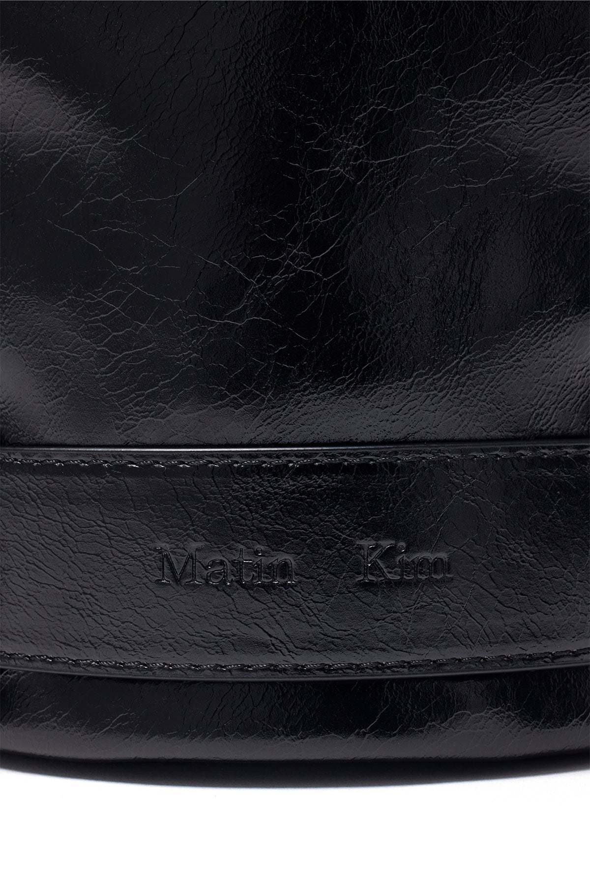 [matinkim] BELTED MINI BUCKET BAG IN BLACK