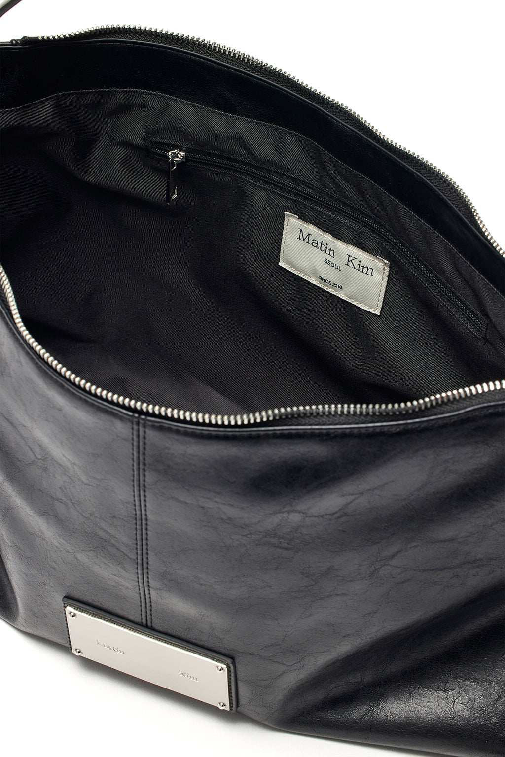 [matinkim] SIDE ZIPPER SHOULDER BAG IN BLACK