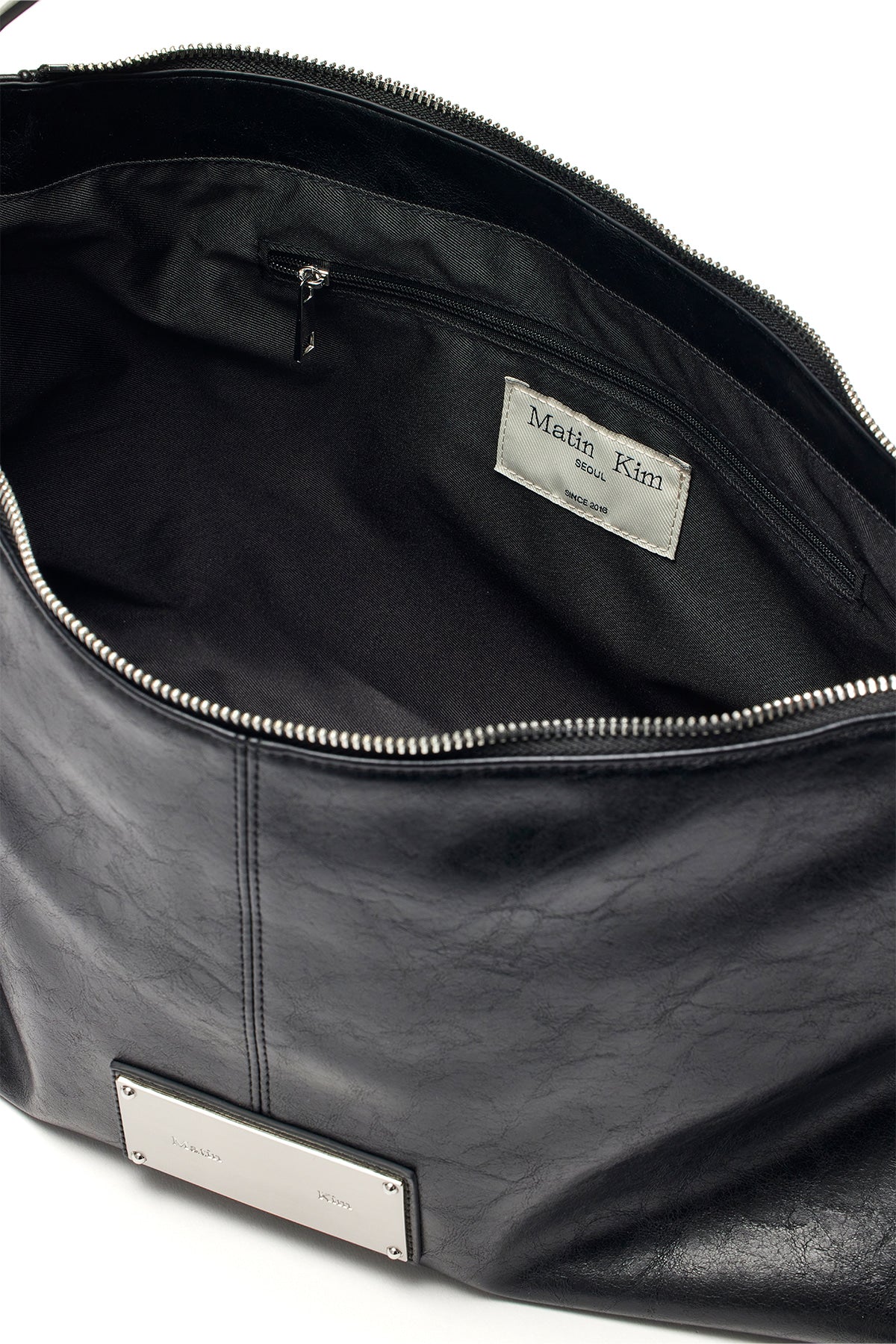 [matinkim] SIDE ZIPPER SHOULDER BAG IN BLACK