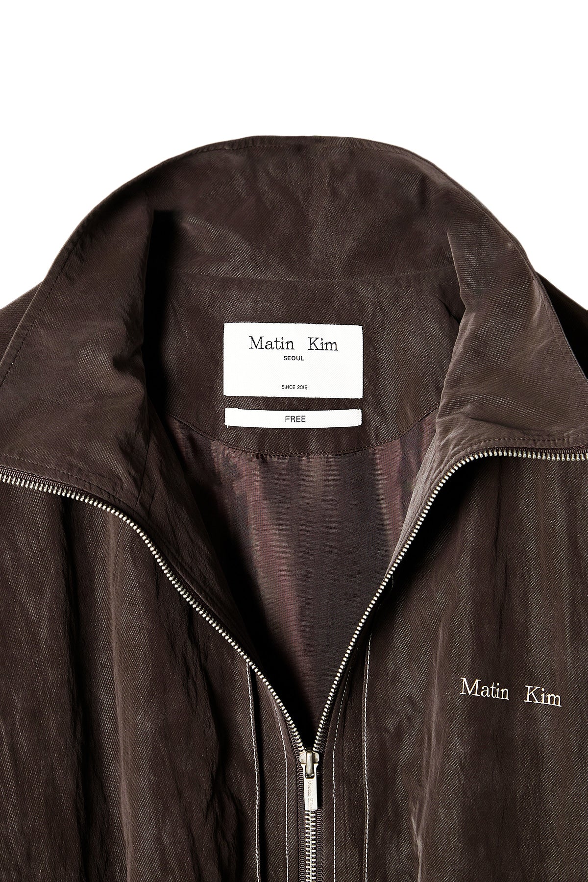 [matinkim] STITCH POINT HIGH NECK JUMPER IN BROWN